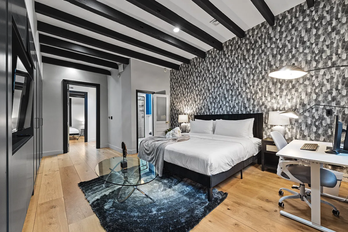 58 Downing Street Manhattan, NY 10014 - Photo 14 of 21 a bedroom with bed and a night stand