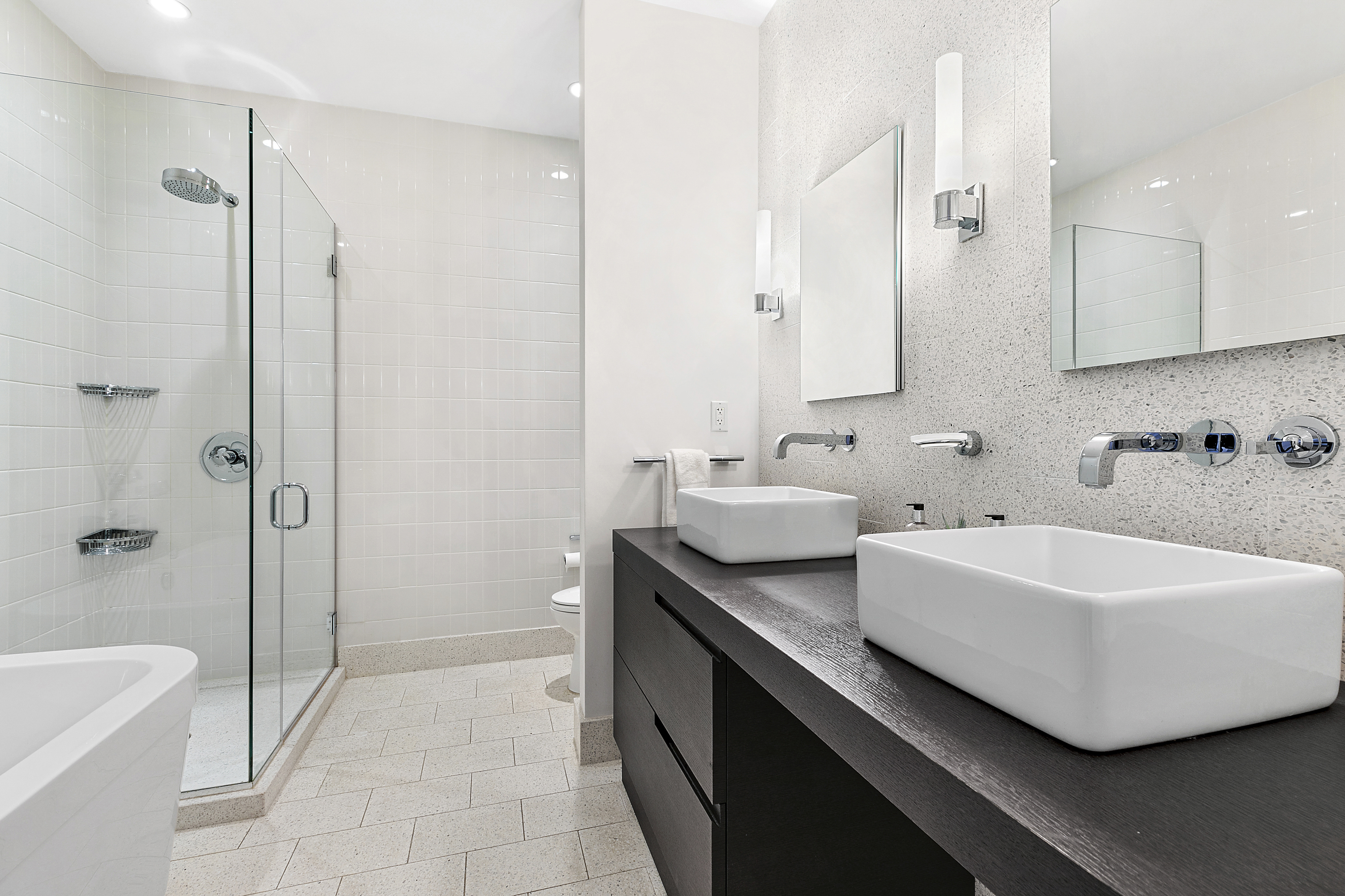 360 Furman Street, Unit 812 Brooklyn, NY 11201 - Photo 9 of 39 a spacious bathroom with a tub sink and mirror