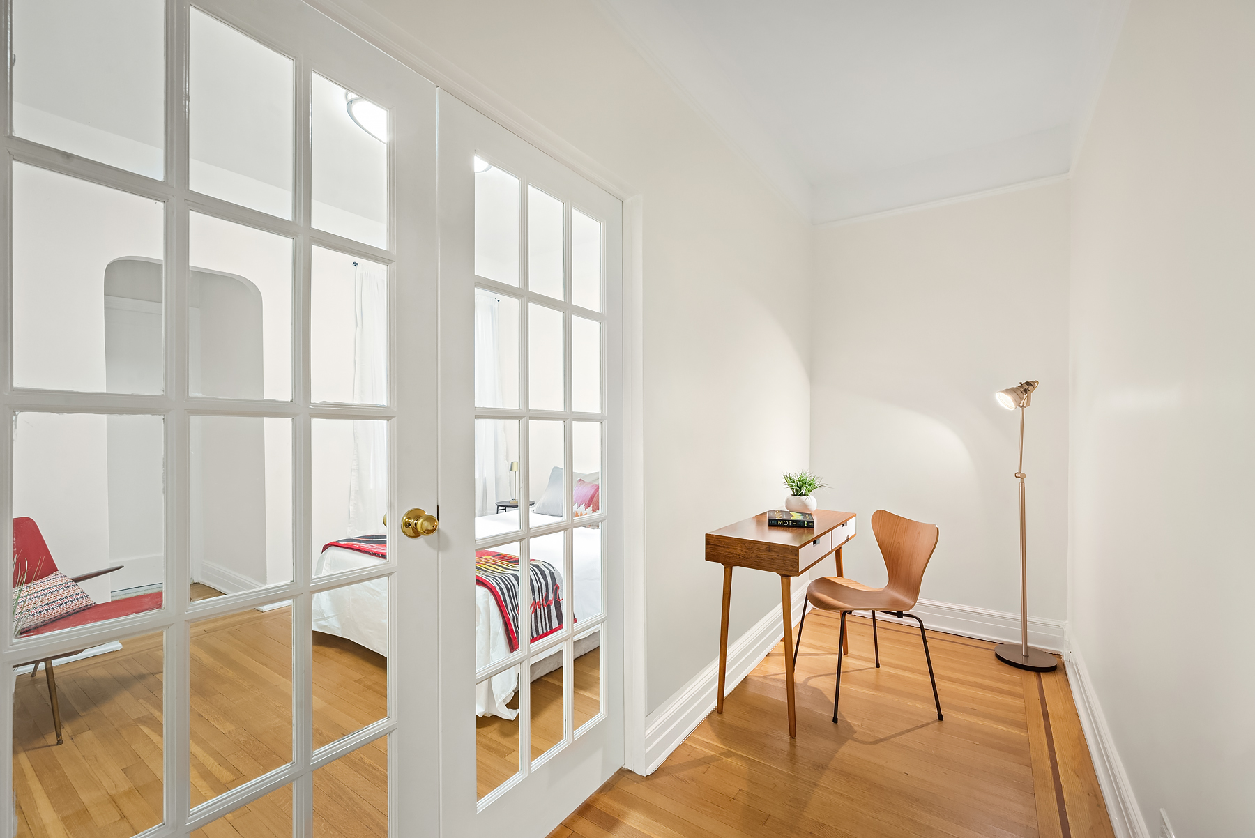124 East 91st Street, Unit 3D Manhattan, NY 10128 - Photo 5 of 11 a view of a workspace with furniture and a window