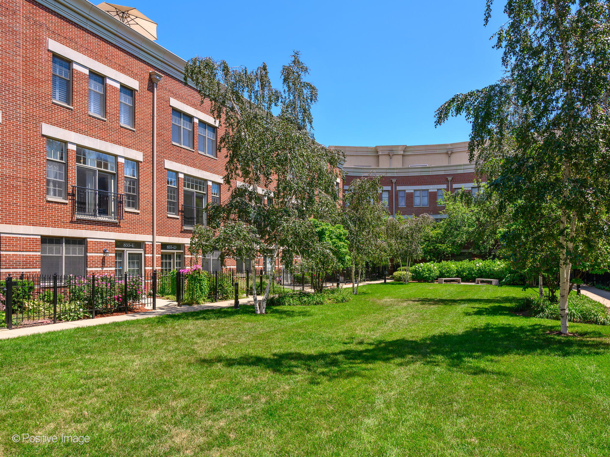 855 North May Street, Unit G Chicago, IL 60642 - Photo 28 of 28 a view of a building with a yard