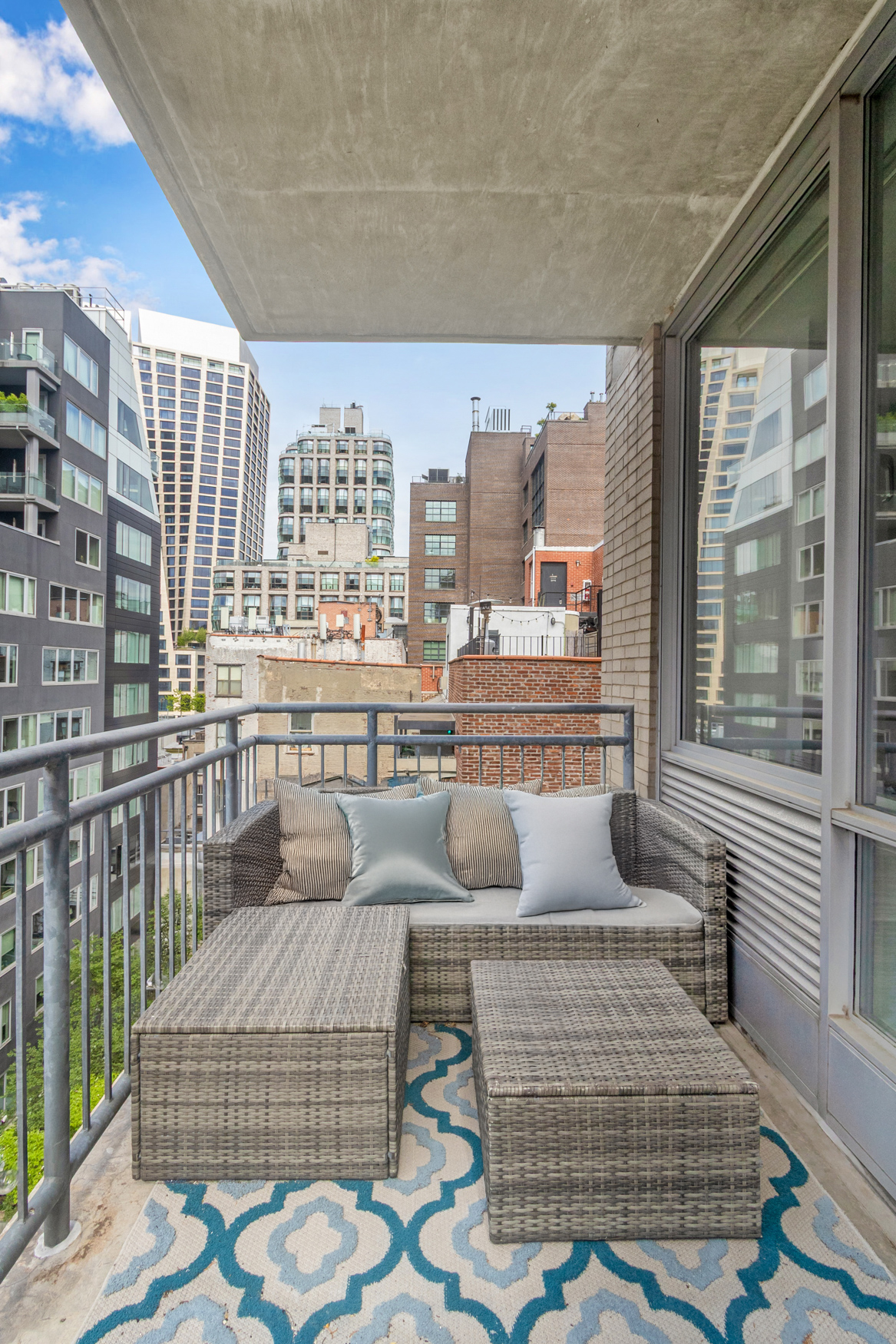 444 West 19th Street, Unit 701 Manhattan, NY 10011 - Photo 6 of 11 a living room with furniture and a large window