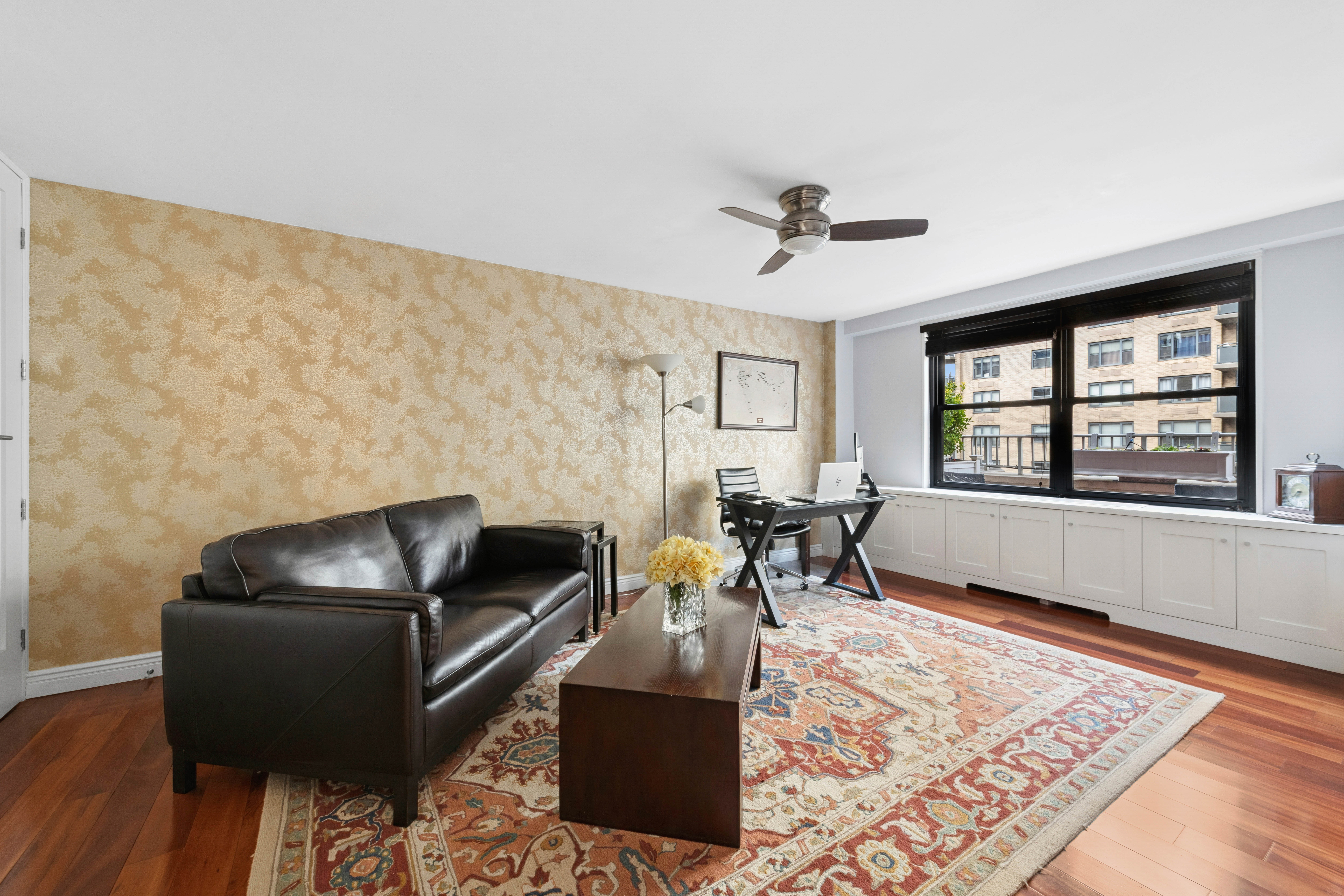 305 East 40th Street, Unit 19CD Manhattan, NY 10016 - Photo 9 of 16 a living room with furniture and a window