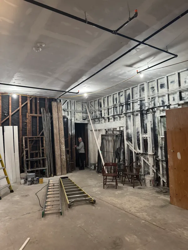 a picture of a room with a floor to a white wall