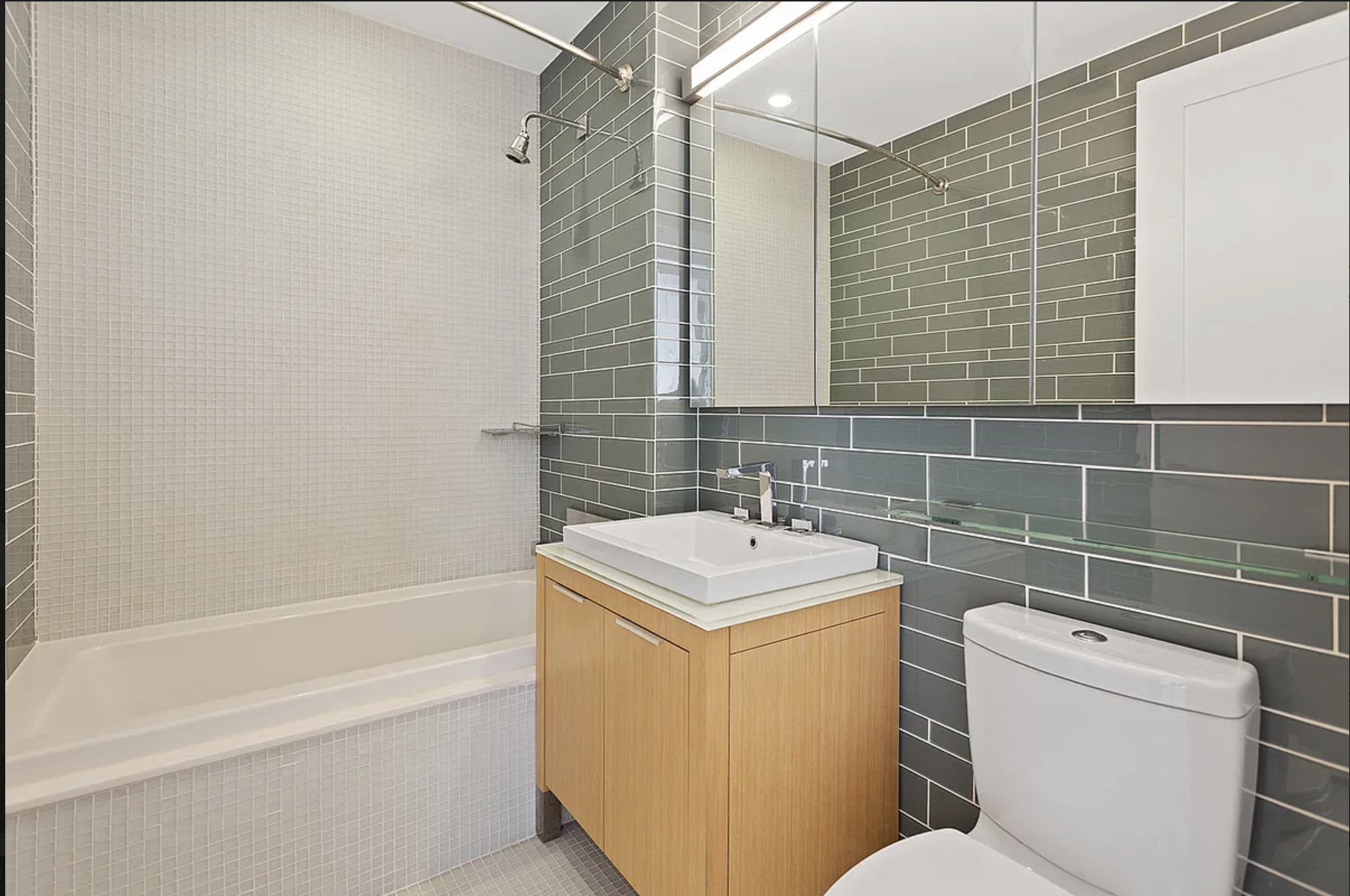 22 North 6th Street, Unit 12J Brooklyn, NY 11249 - Photo 6 of 13 a bathroom with a sink toilet and shower