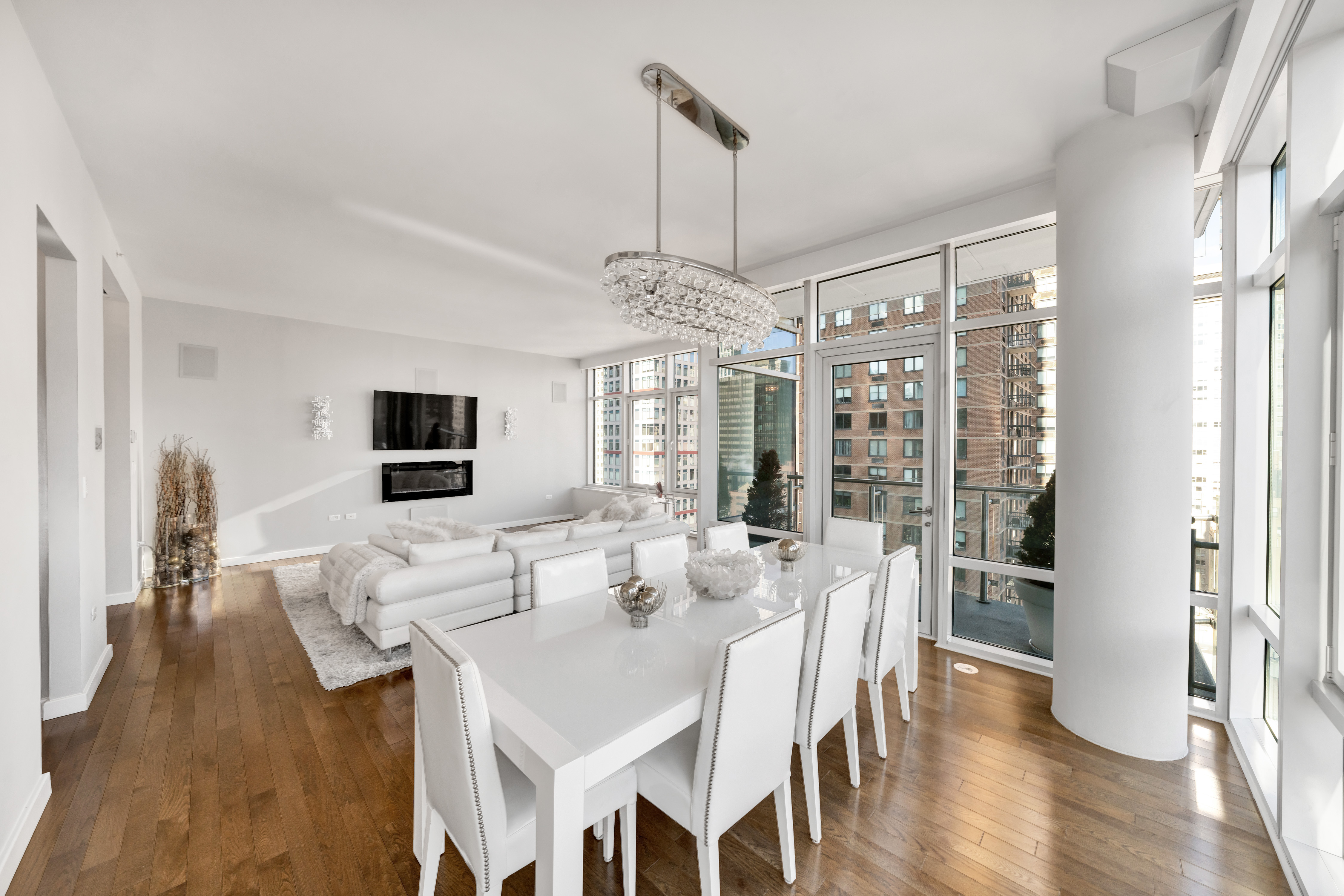 310 East 53rd Street, Unit 18A Manhattan, NY 10022 - Photo 5 of 19 a view of a dining room with furniture window and wooden floor