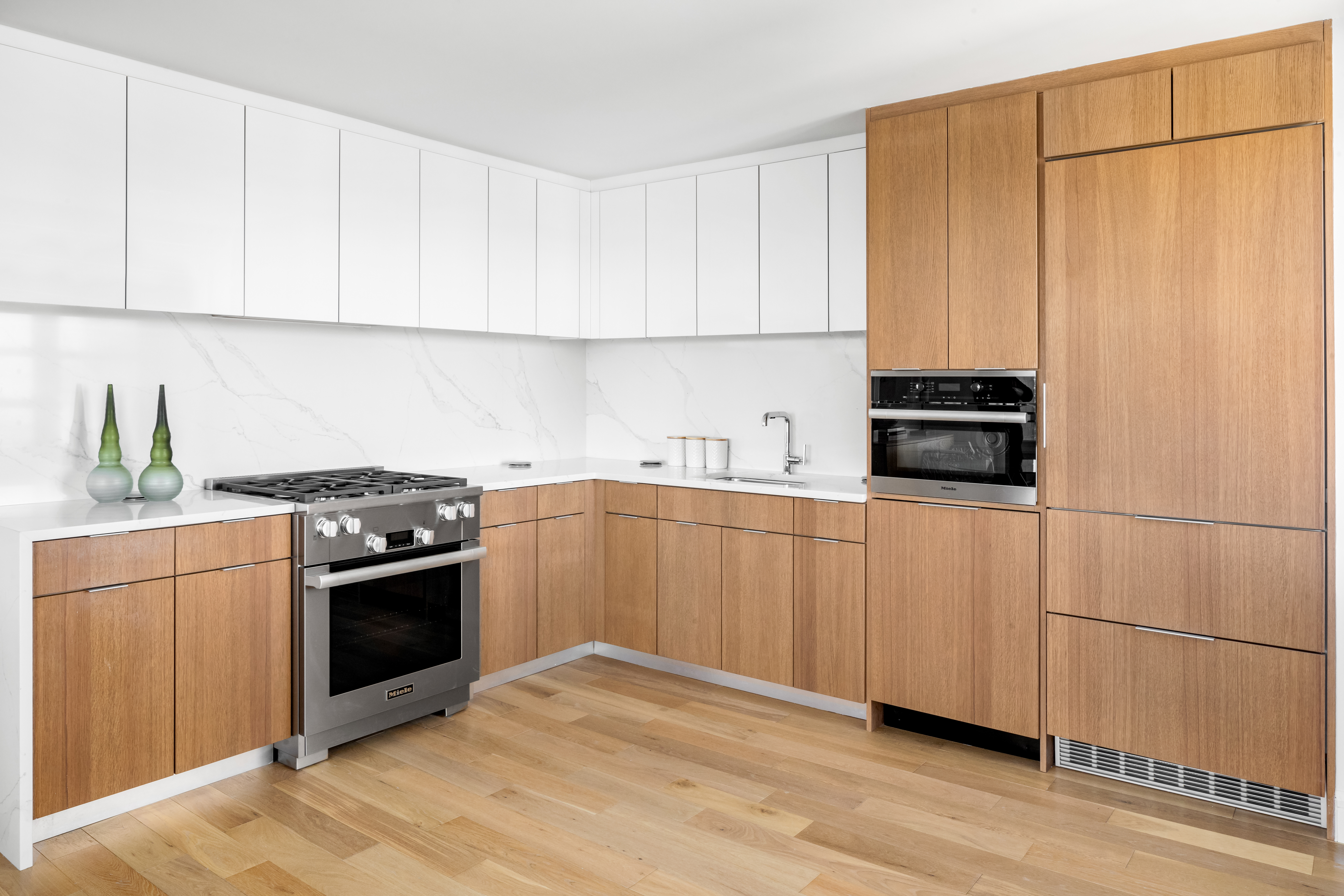 175 West 95th Street, Unit 19G Manhattan, NY 10025 - Photo 5 of 14 a kitchen with stainless steel appliances granite countertop a stove a sink and a microwave