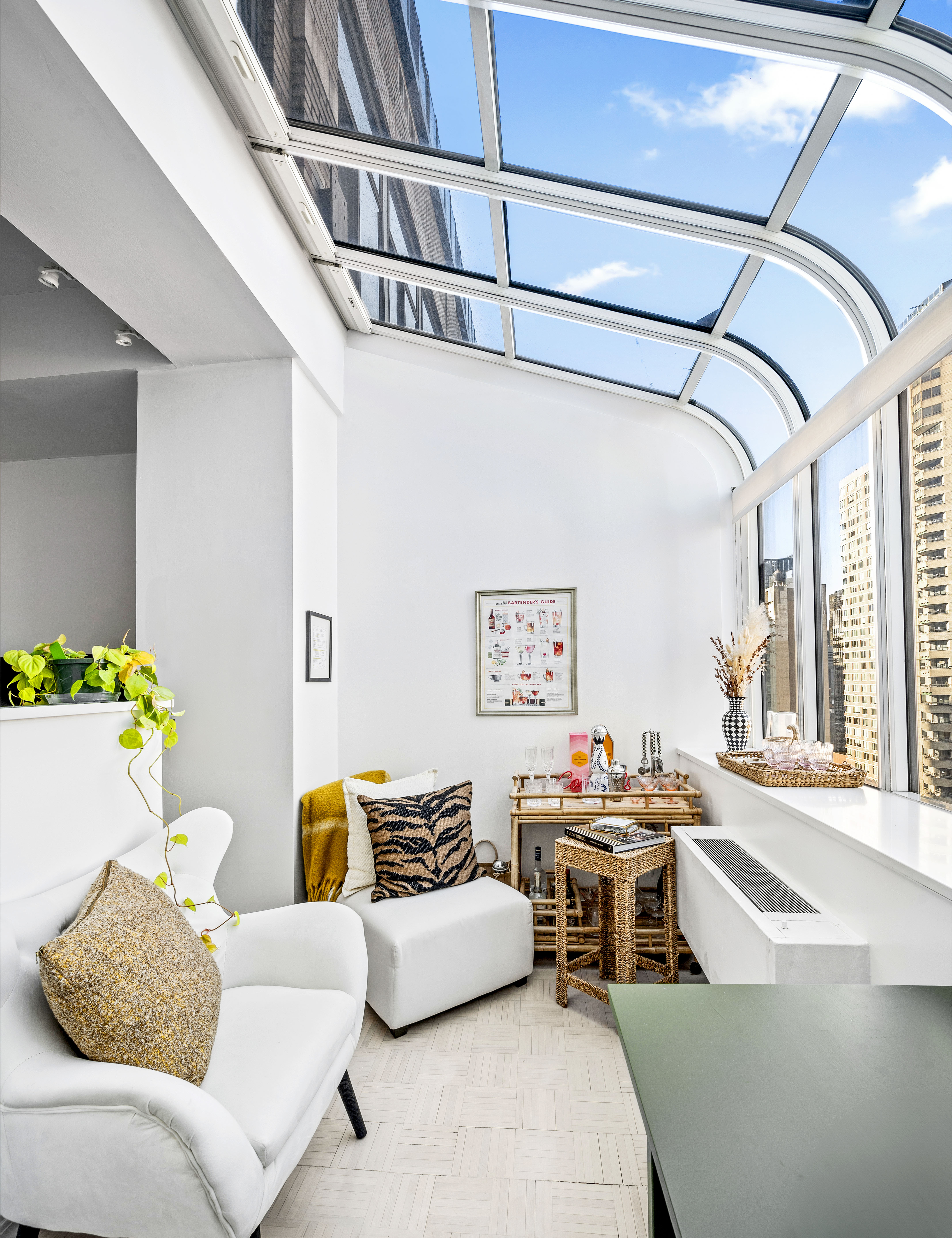 310 East 46th Street, Unit 19F Manhattan, NY 10017 - Photo 2 of 17 a living room with furniture and a flat screen tv