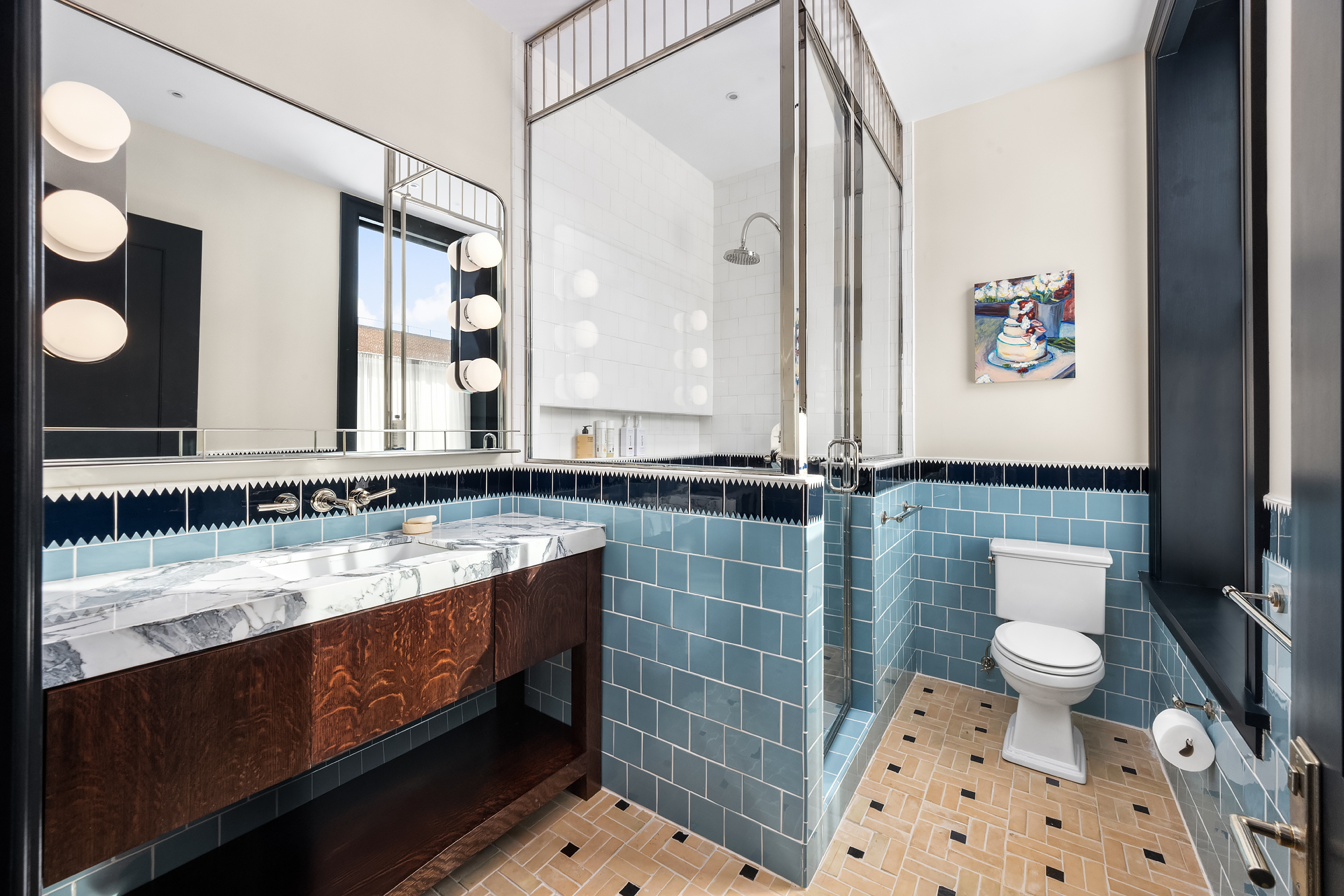 158 Mercer Street, Unit 6B Manhattan, NY 10012 - Photo 11 of 16 a bathroom with a sink a toilet and shower