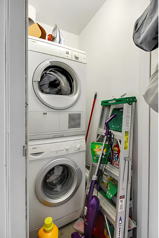 517 West 46th Street, Unit 307 Manhattan, NY 10036 - Photo 7 of 10 a utility room with dryer and washer
