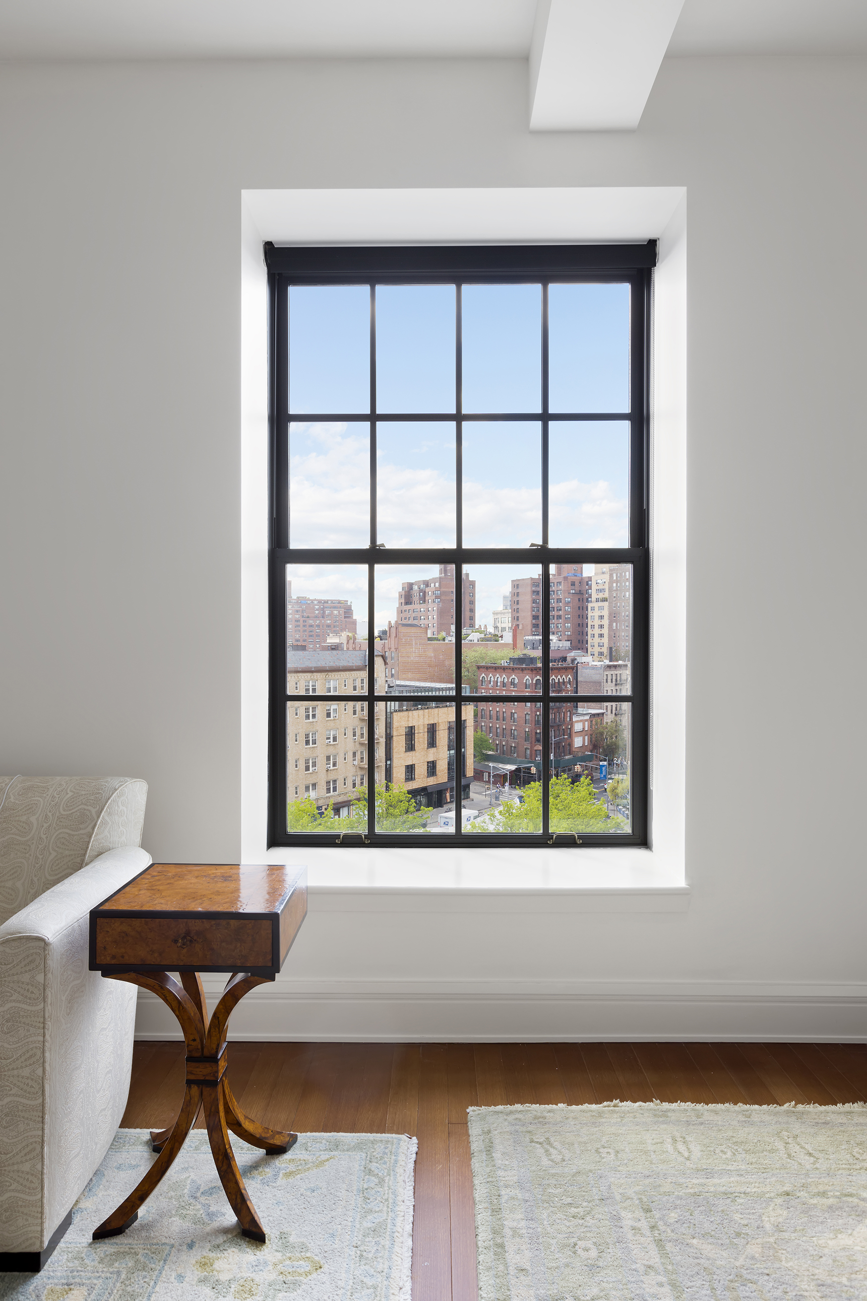 160 West 12th Street, Unit 78 Manhattan, NY 10011 - Photo 4 of 22 a room with a table and windows
