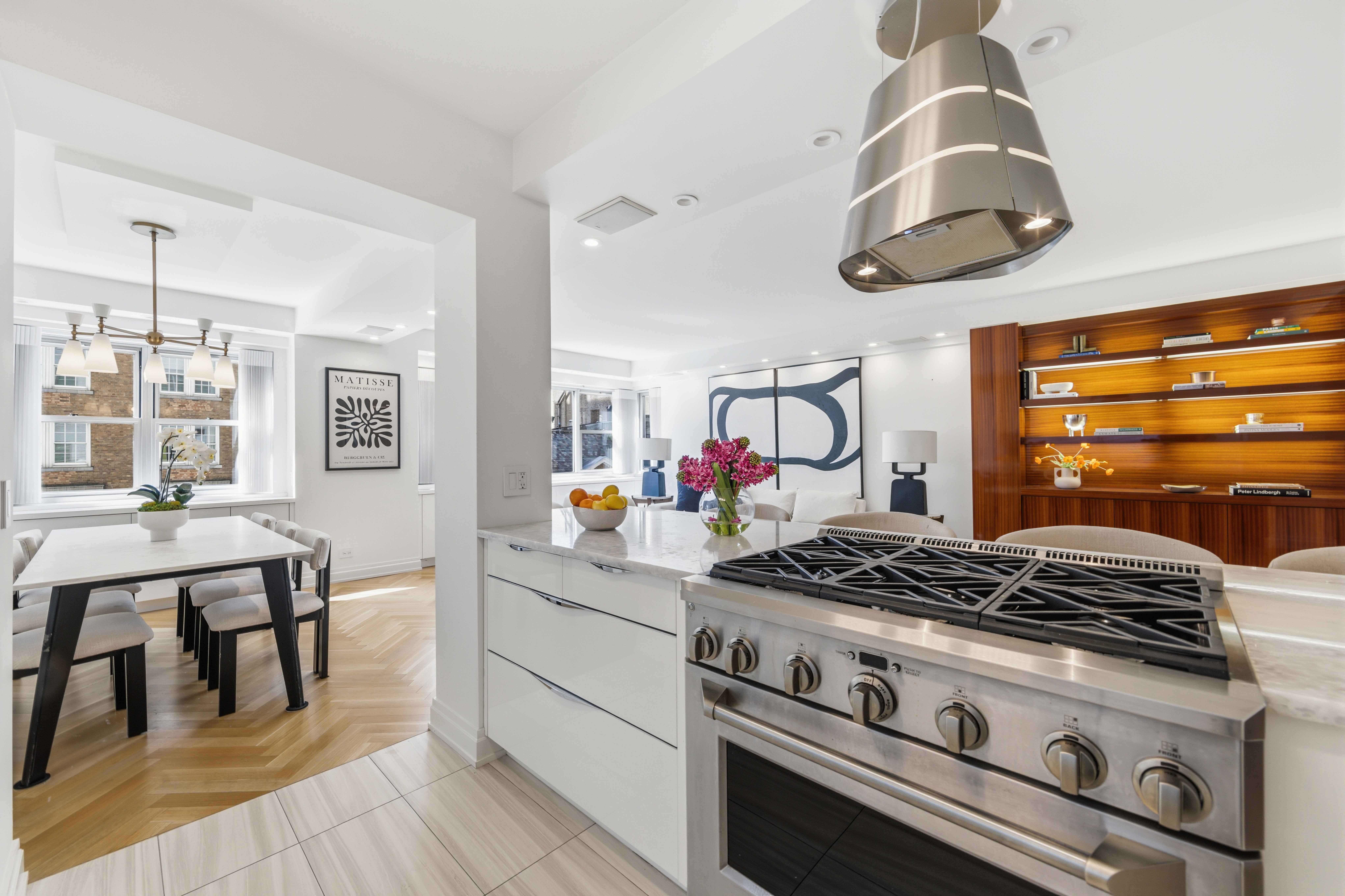 40 East 78th Street, Unit 5E Manhattan, NY 10075 - Photo 1 of 23 a kitchen with a stove and cabinets