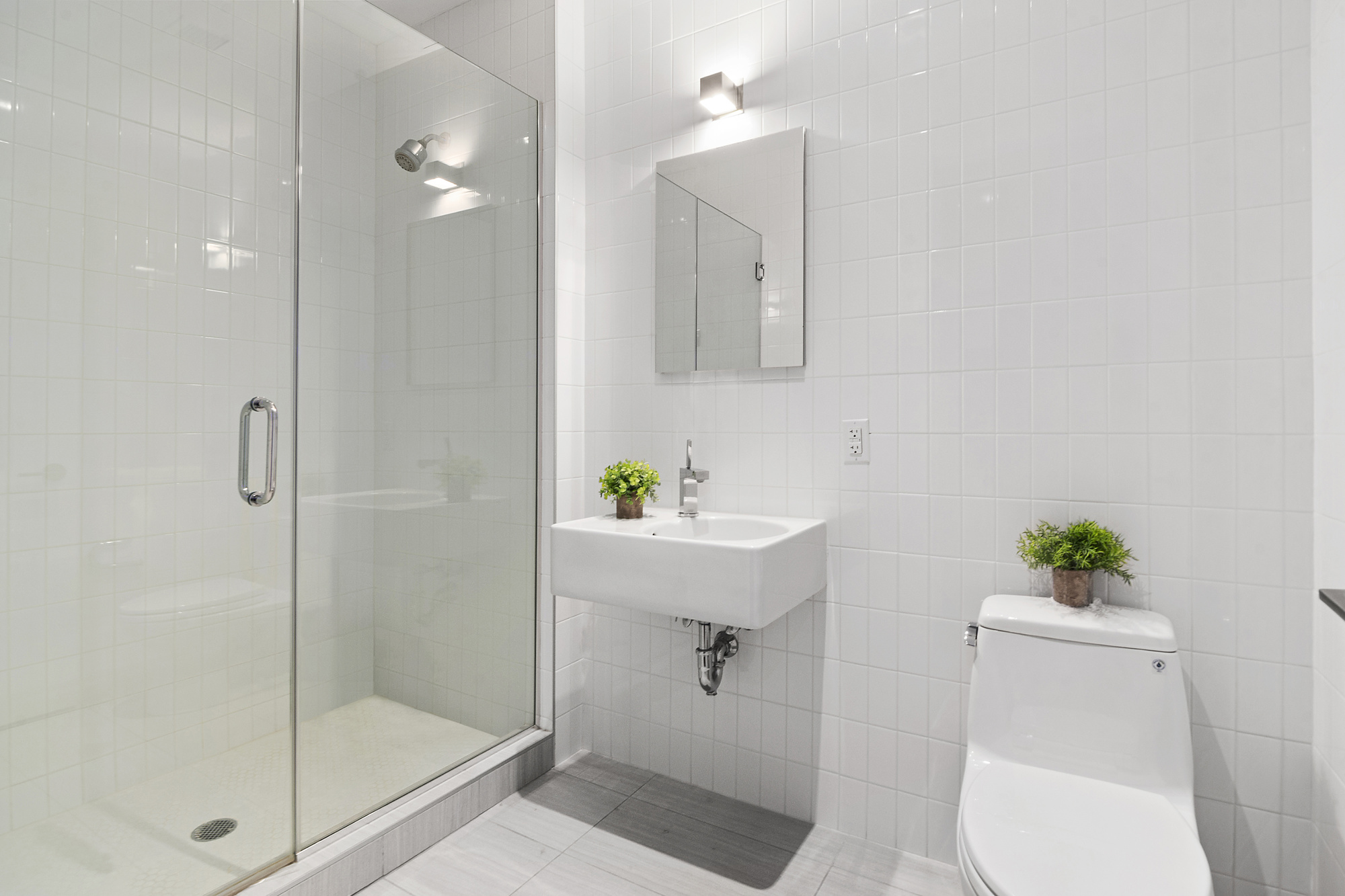 360 Furman Street, Unit 320/321 Brooklyn, NY 11201 - Photo 15 of 28 a bathroom with a sink toilet and shower