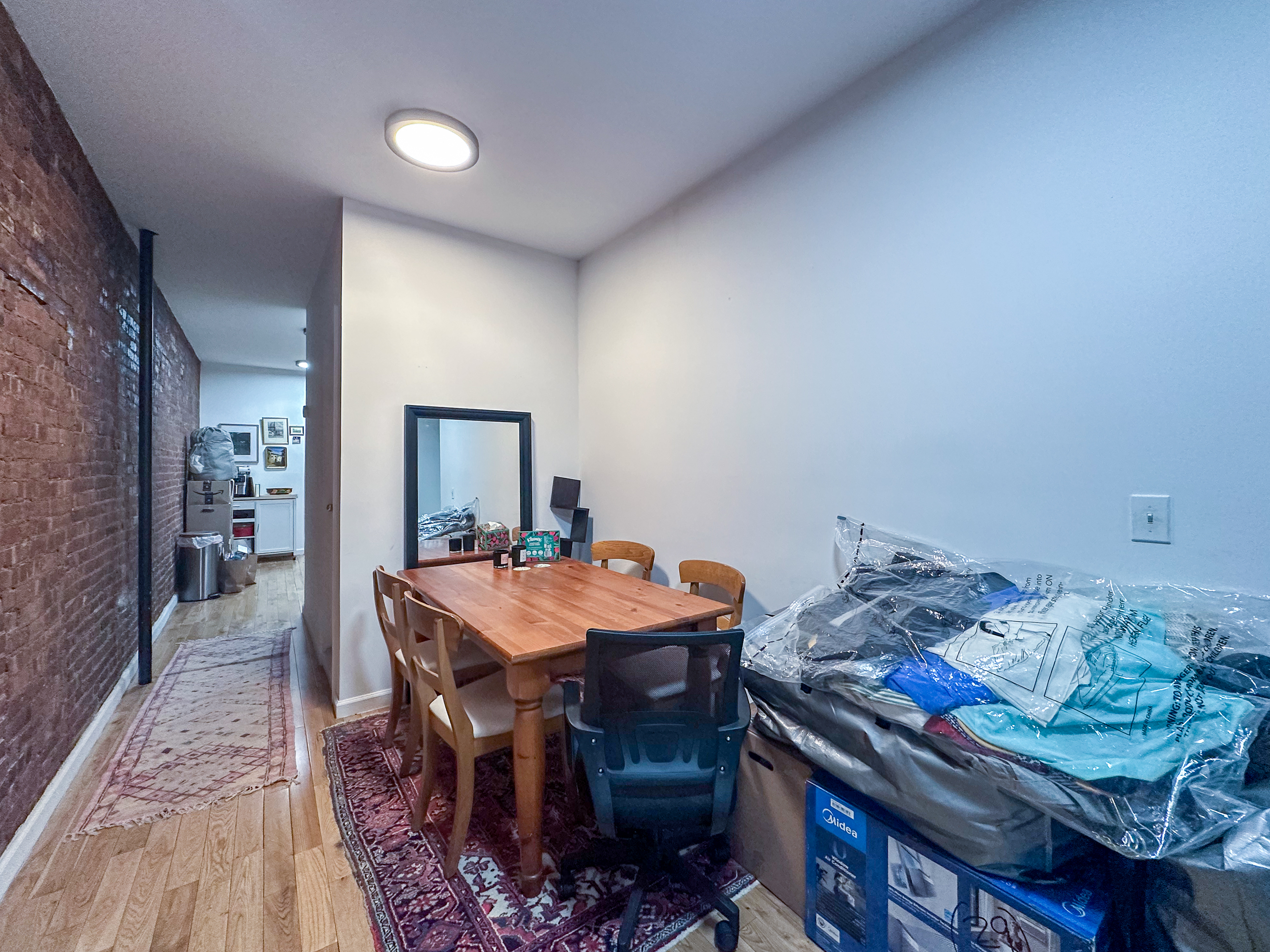 215 East 5th Street, Unit 7 Manhattan, NY 10003 - Photo 6 of 15 a view of a dining room with furniture
