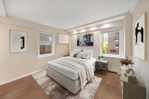 a bedroom with a large bed and a window