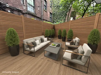 a view of a patio with couches and potted plants