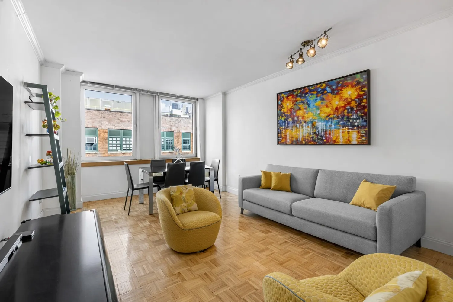 a living room with furniture and a flat screen tv