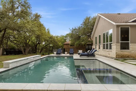 a view of a swimming pool with a patio