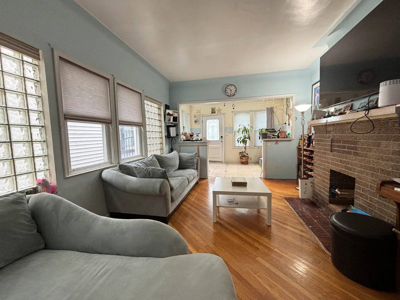 a living room with furniture fireplace and flat screen tv