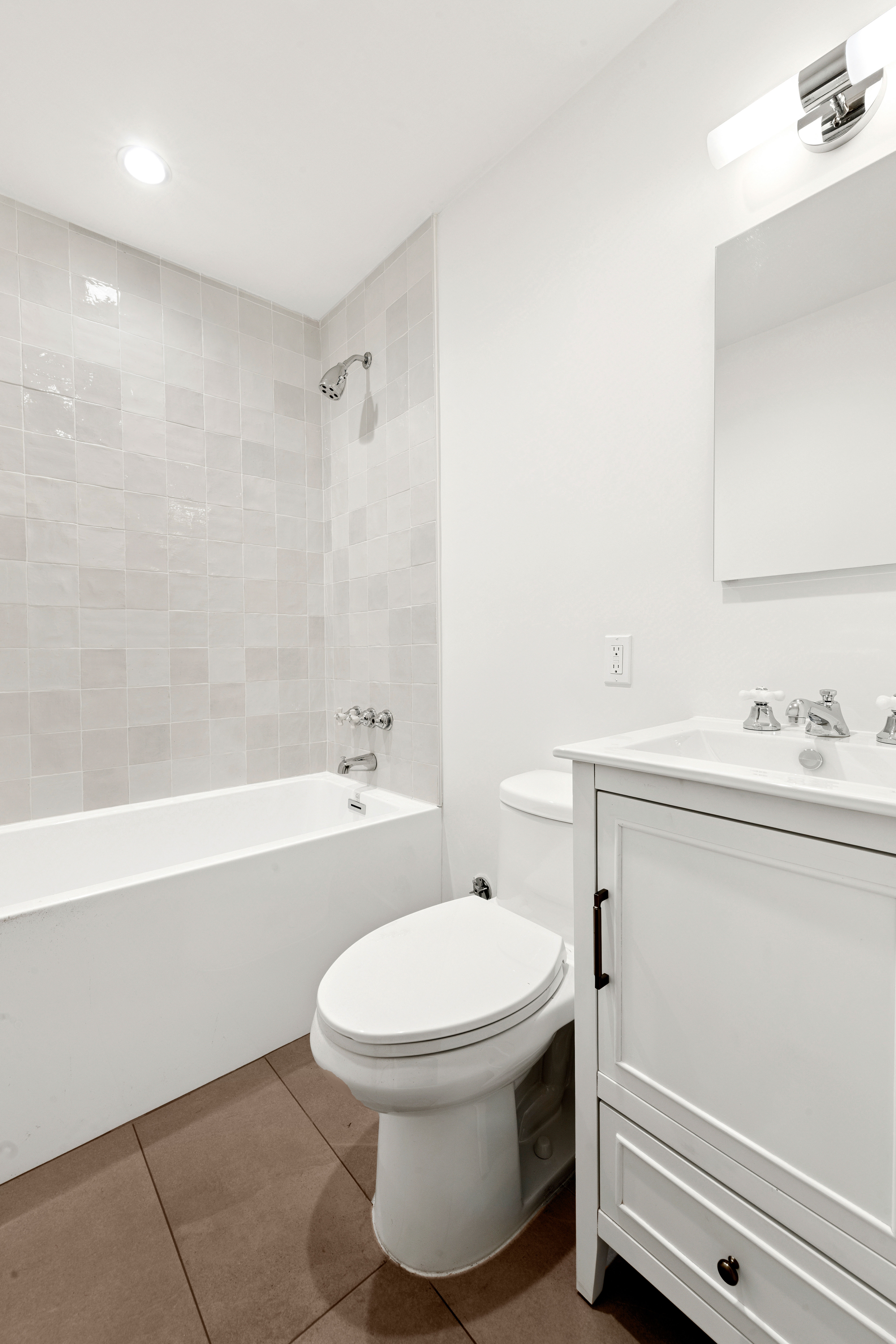 765 Greenwich Street, Unit 1 Manhattan, NY 10014 - Photo 11 of 14 a bathroom with a sink a toilet and a bathtub
