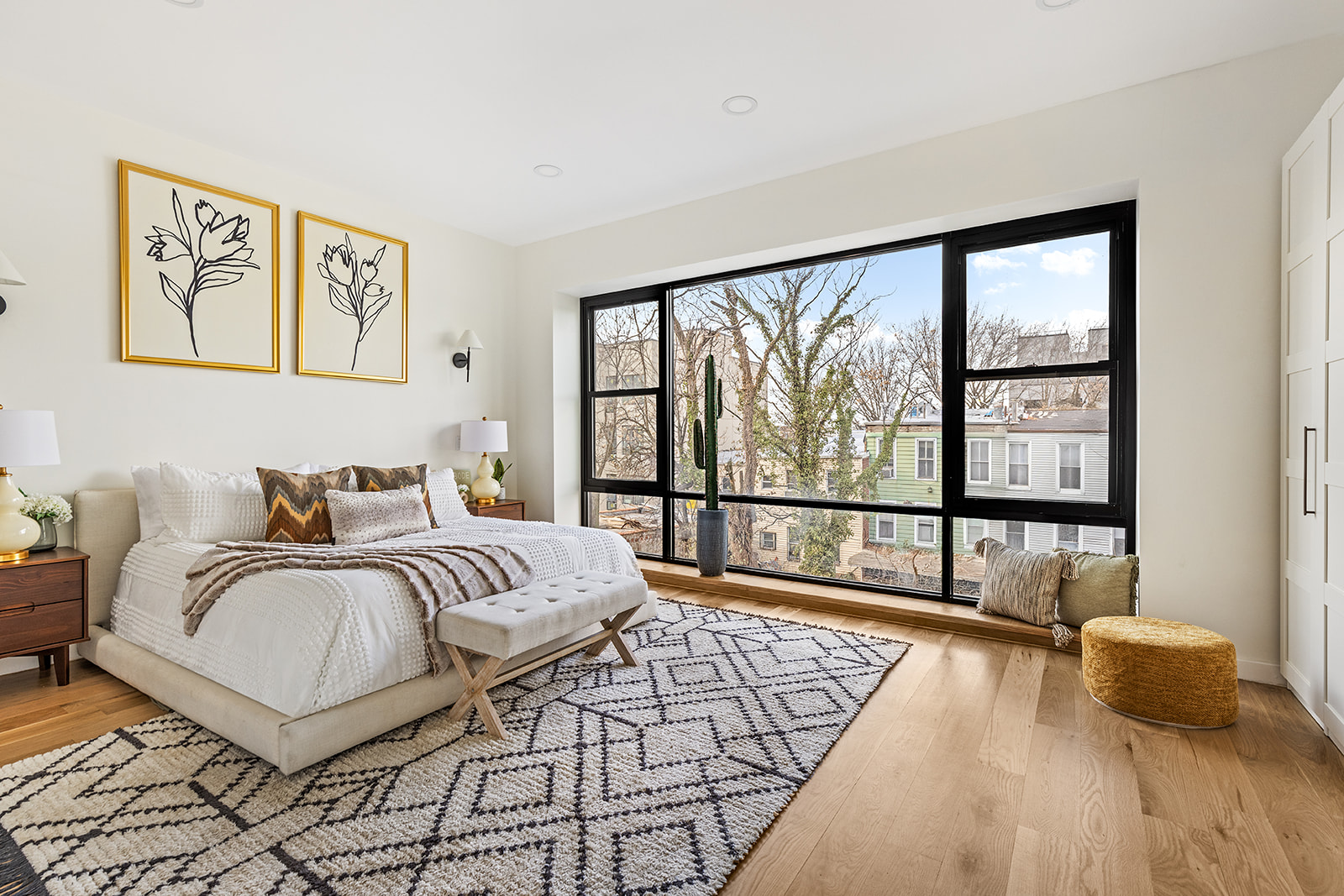 95 Moffat Street Brooklyn, NY 11207 - Photo 7 of 18 a spacious bedroom with a large bed and a large window