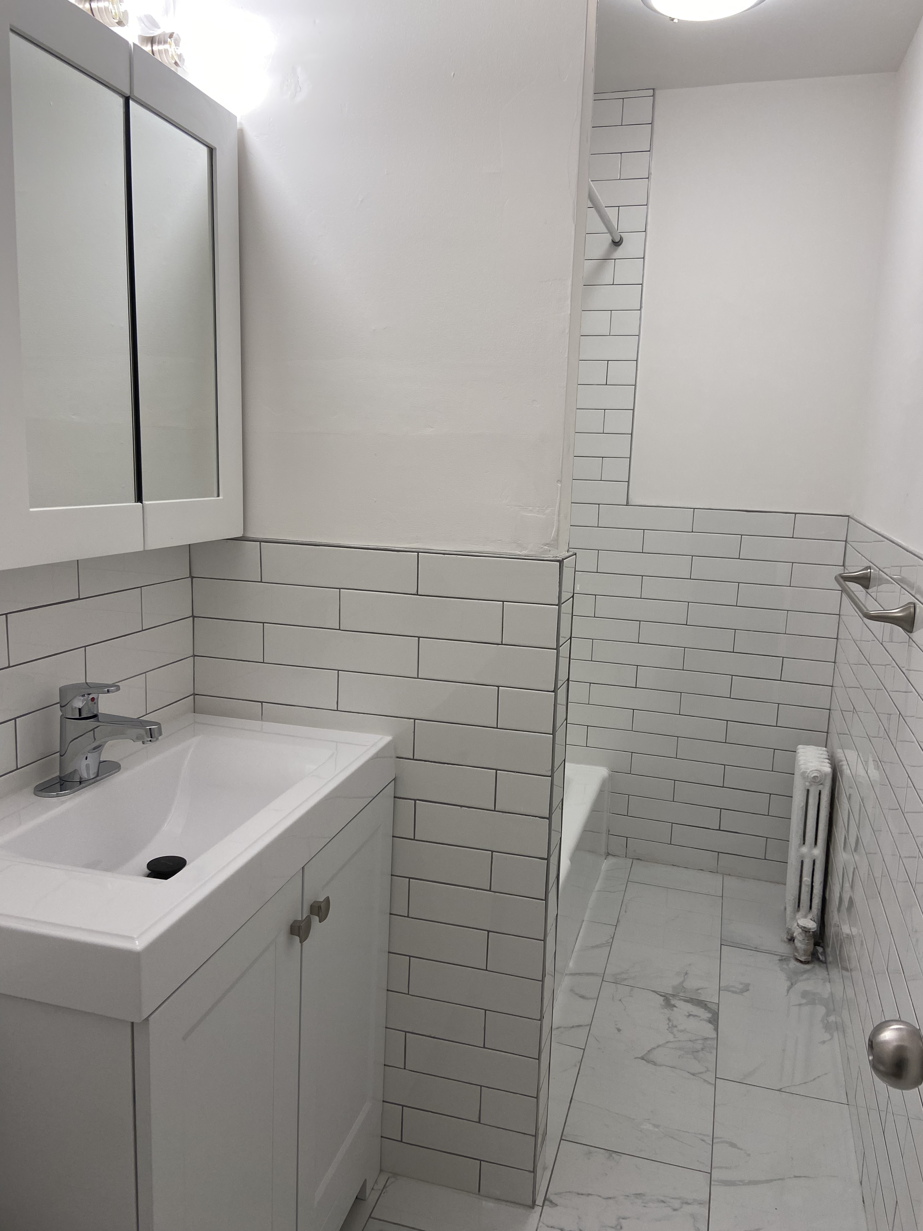 330 East 58th Street, Unit 1C Manhattan, NY 10022 - Photo 7 of 9 a bathroom with a sink and cabinets