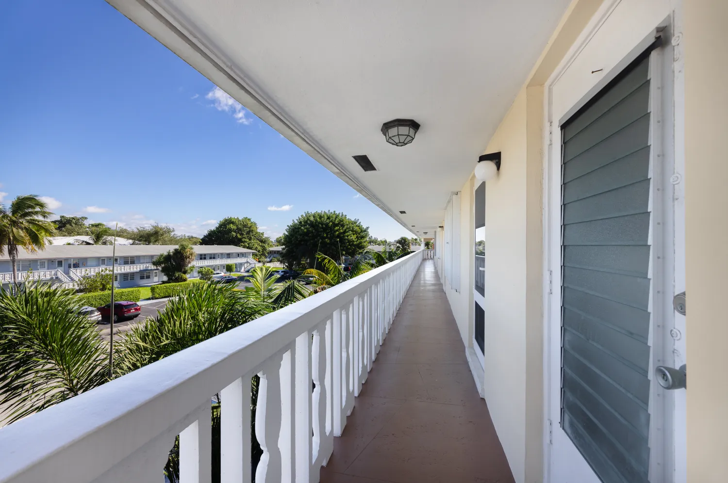 a view of swimming pool with outdoor seating and a garden