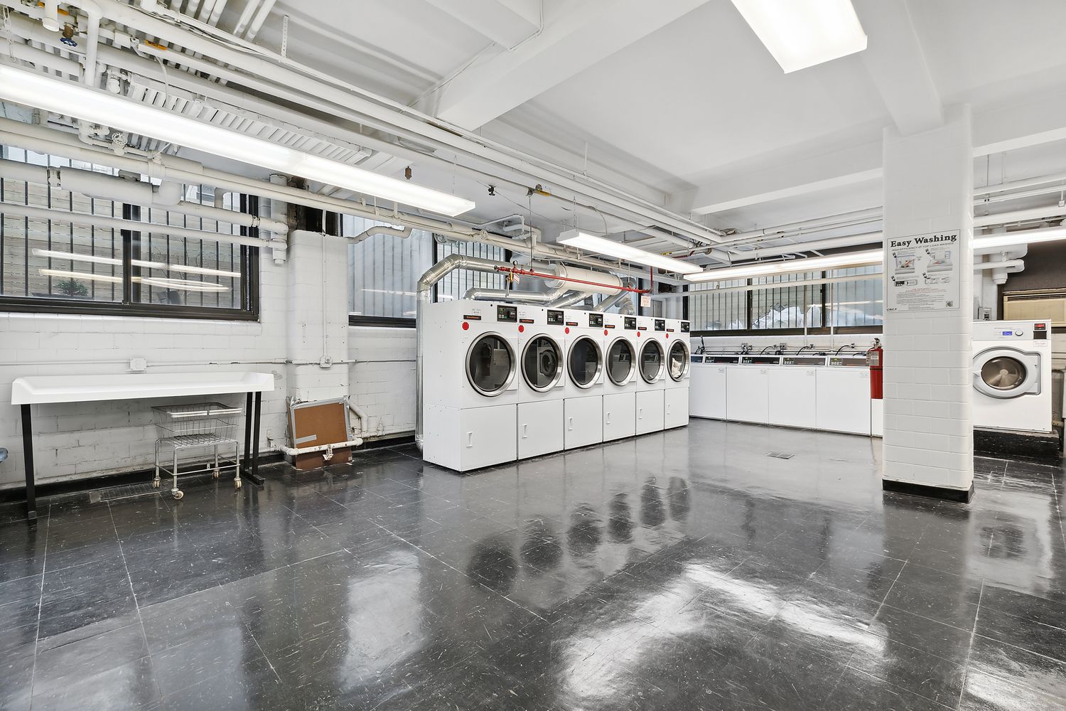 235 East 73rd Street, Unit 1D Manhattan, NY 10021 - Photo 11 of 13 a white refrigerator freezer sitting inside of a kitchen