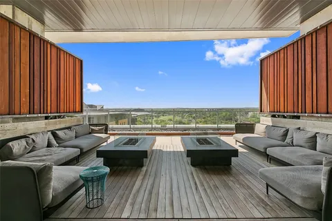 a living room with couches and a flat screen tv