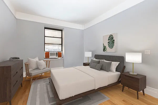 310 West 97th Street, Unit 21 Manhattan, NY 10025 - Photo 9 of 19 a bedroom with a bed and wooden floor