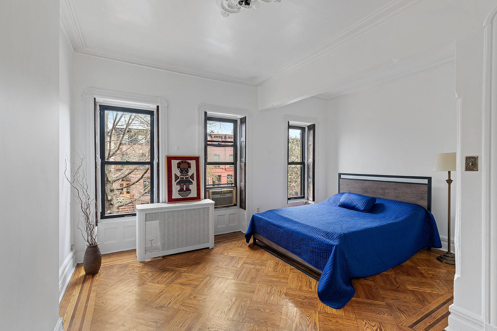 156 Bainbridge Street Brooklyn, NY 11233 - Photo 10 of 14 a bedroom with a bed and a window
