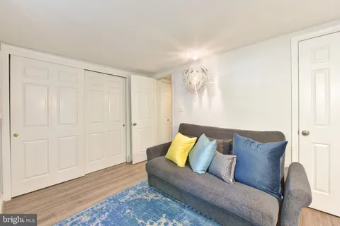 a living room with furniture and a rug
