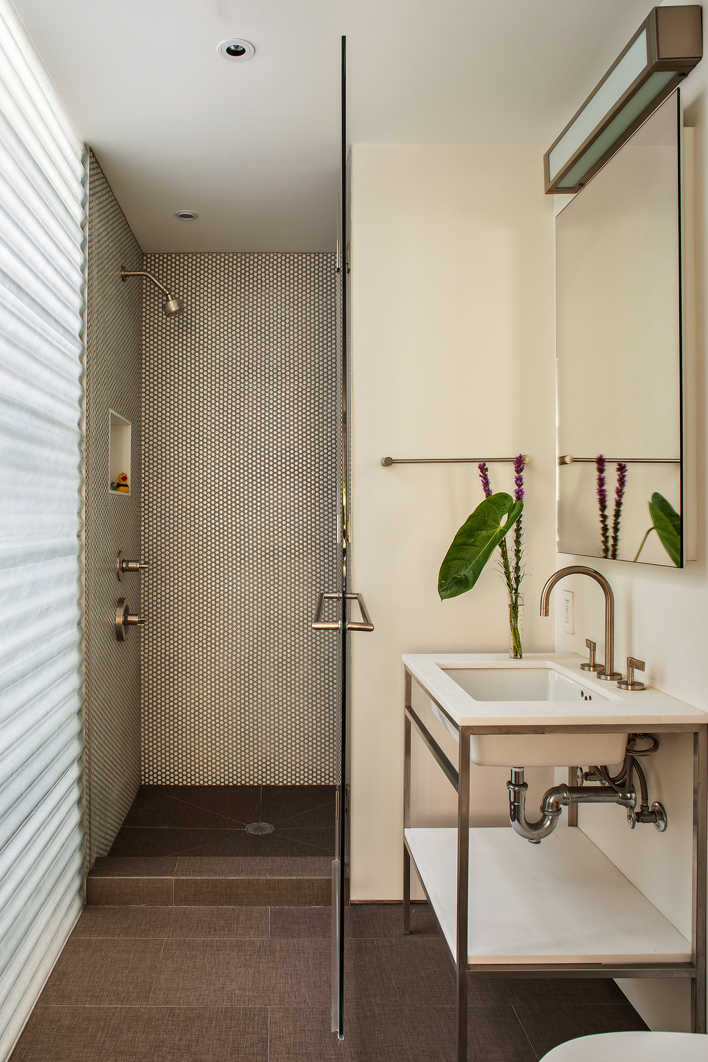 12 Sidney Place Brooklyn, NY 11201 - Photo 24 of 36 a bathroom with a sink and mirror