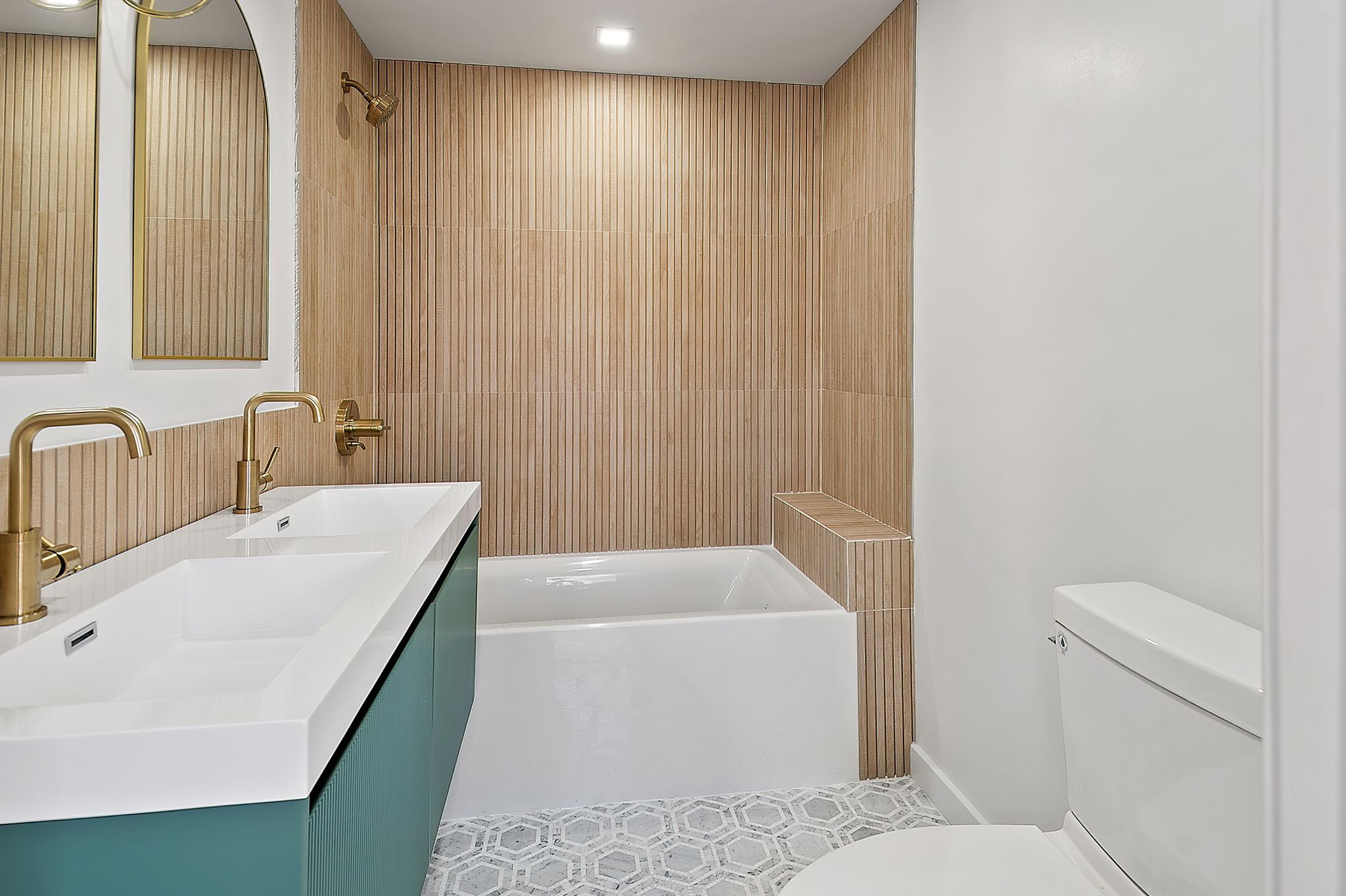 181 Kosciuszko Street Brooklyn, NY 11216 - Photo 12 of 20 a bathroom with a sink a toilet and tub