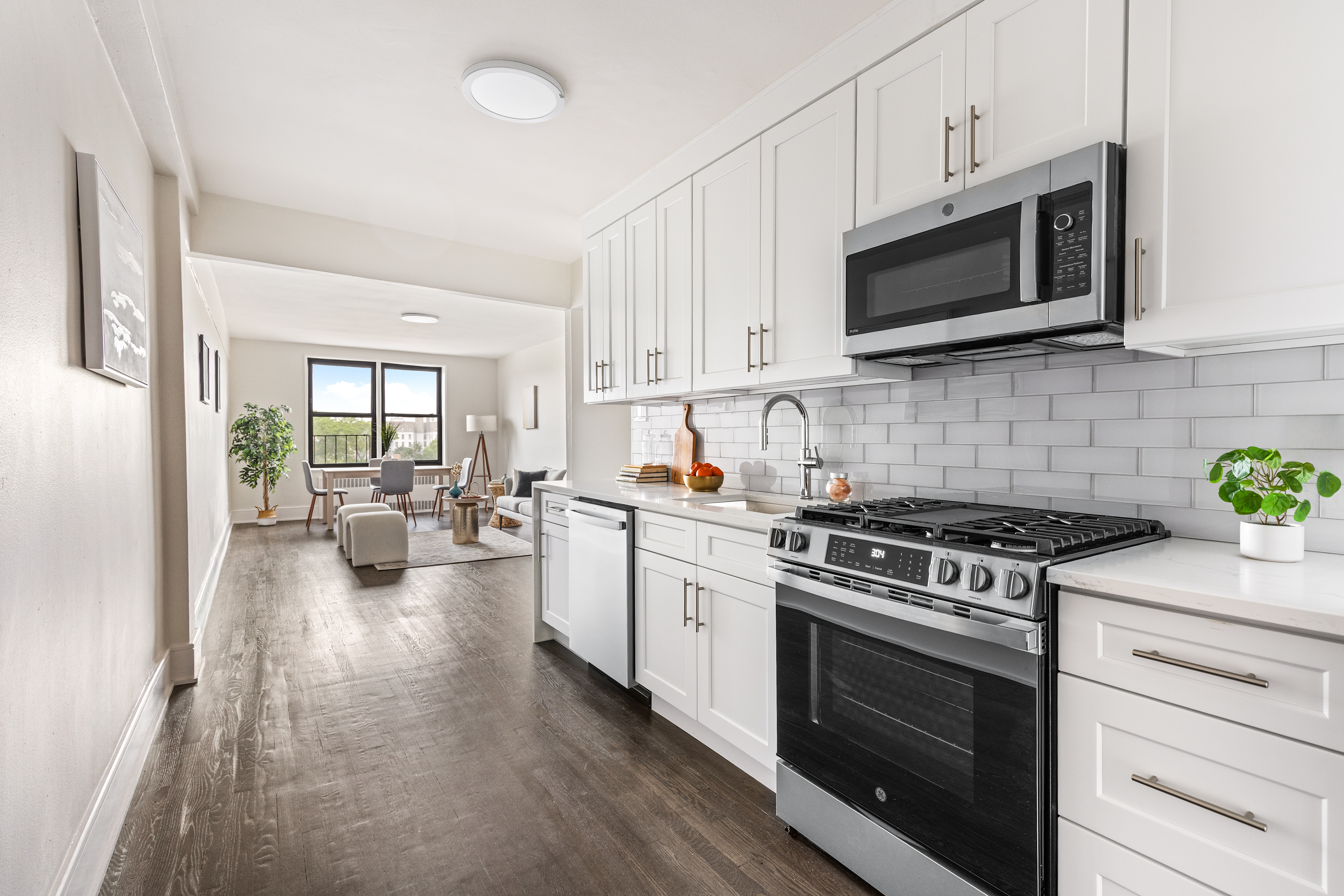 160 Ocean Parkway, Unit 6C Brooklyn, NY 11218 - Photo 3 of 9 a kitchen with stainless steel appliances a stove microwave and cabinets