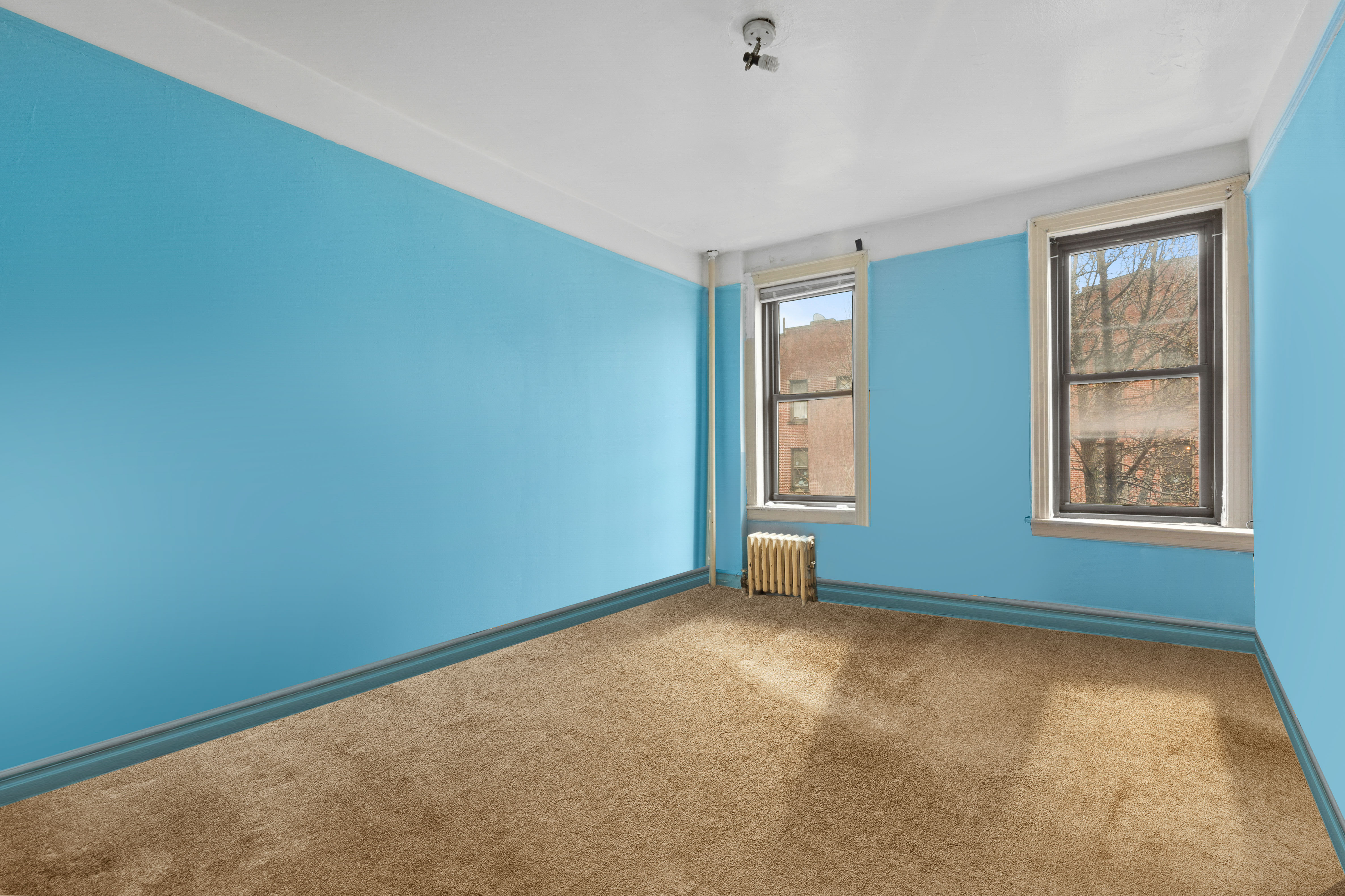 345 Montgomery Street, Unit 3C Brooklyn, NY 11225 - Photo 10 of 17 an empty room with windows