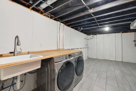 a gym room with lots of clutter and lots of furniture