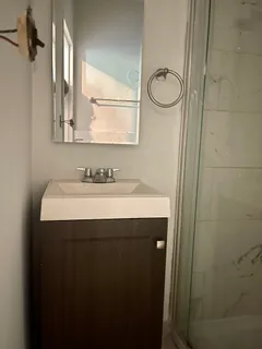 a bathroom with a sink and a mirror