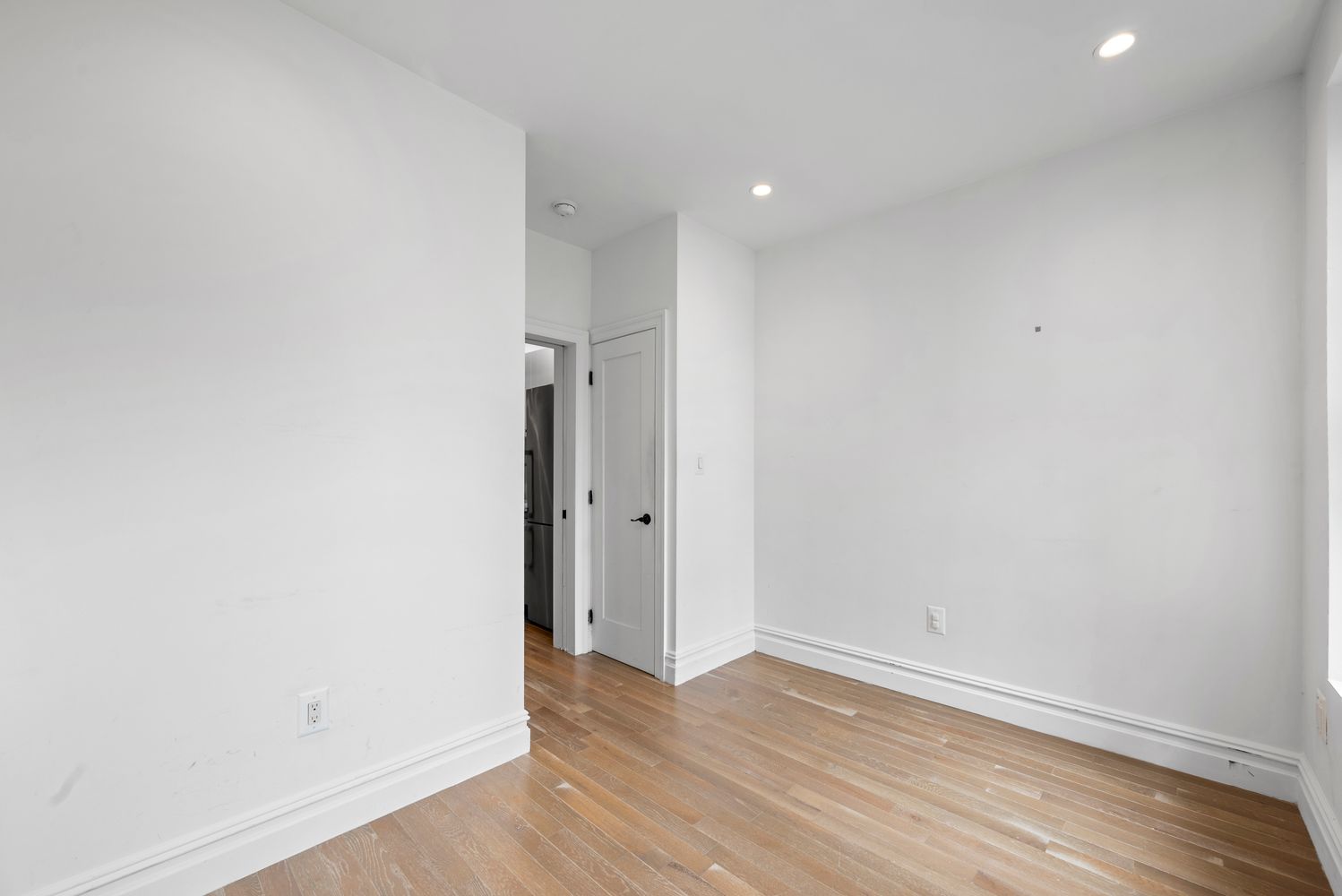 142 Sullivan Street, Unit 14 Manhattan, NY 10012 - Photo 7 of 10 a view of a room with wooden floor