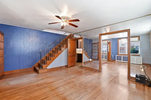 a view of an entryway with wooden floor