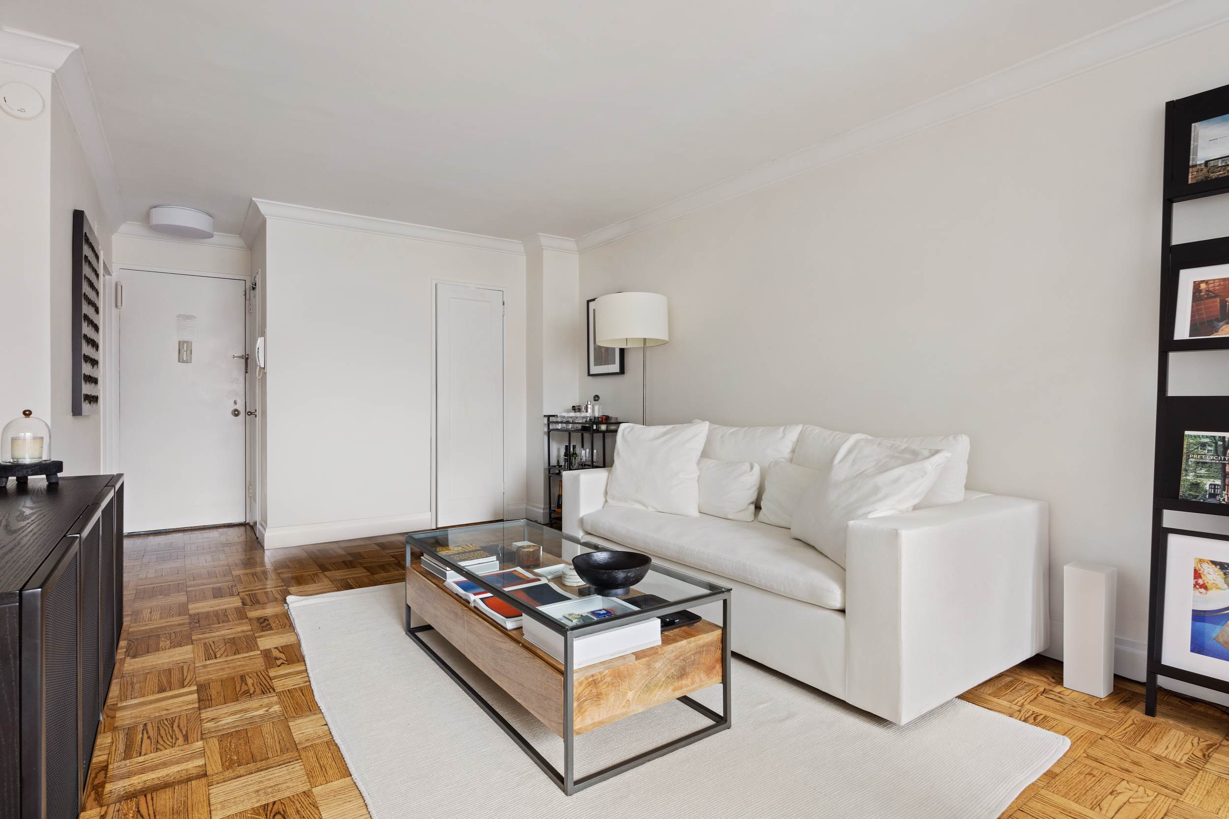 175 West 12th Street, Unit 4L Manhattan, NY 10011 - Photo 5 of 11 a living room with furniture and a couch