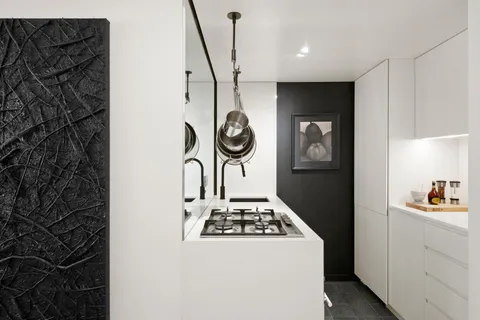 a kitchen with a stove and a refrigerator