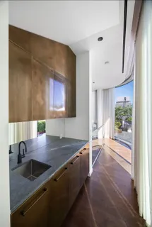 a bedroom with a large bed and a large window