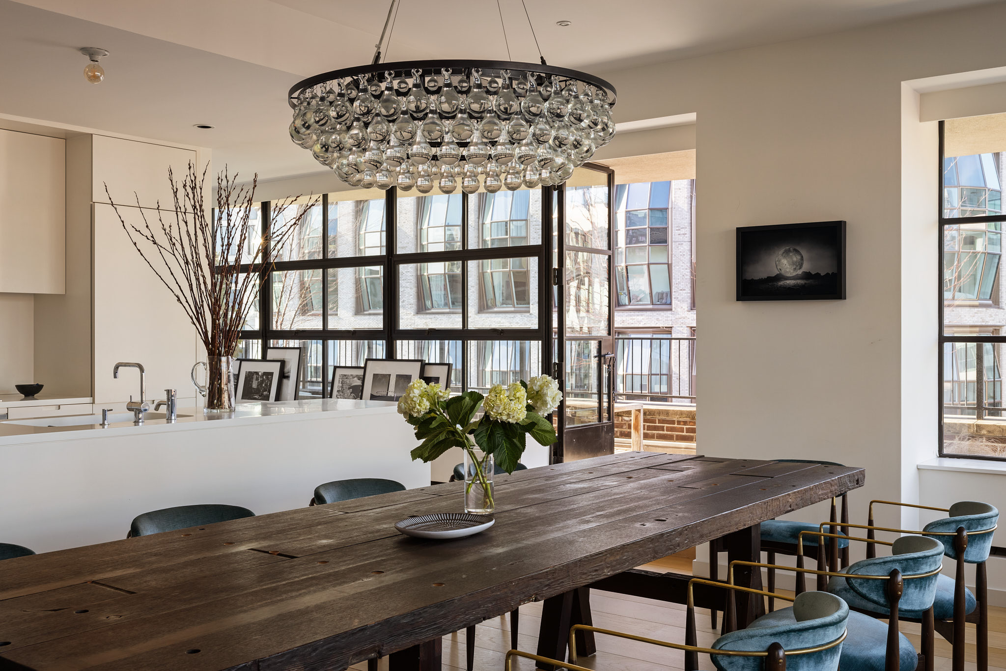 456 West 19th Street, Unit PHH Manhattan, NY 10011 - Photo 5 of 21 a view of a dining room with furniture window and wooden floor