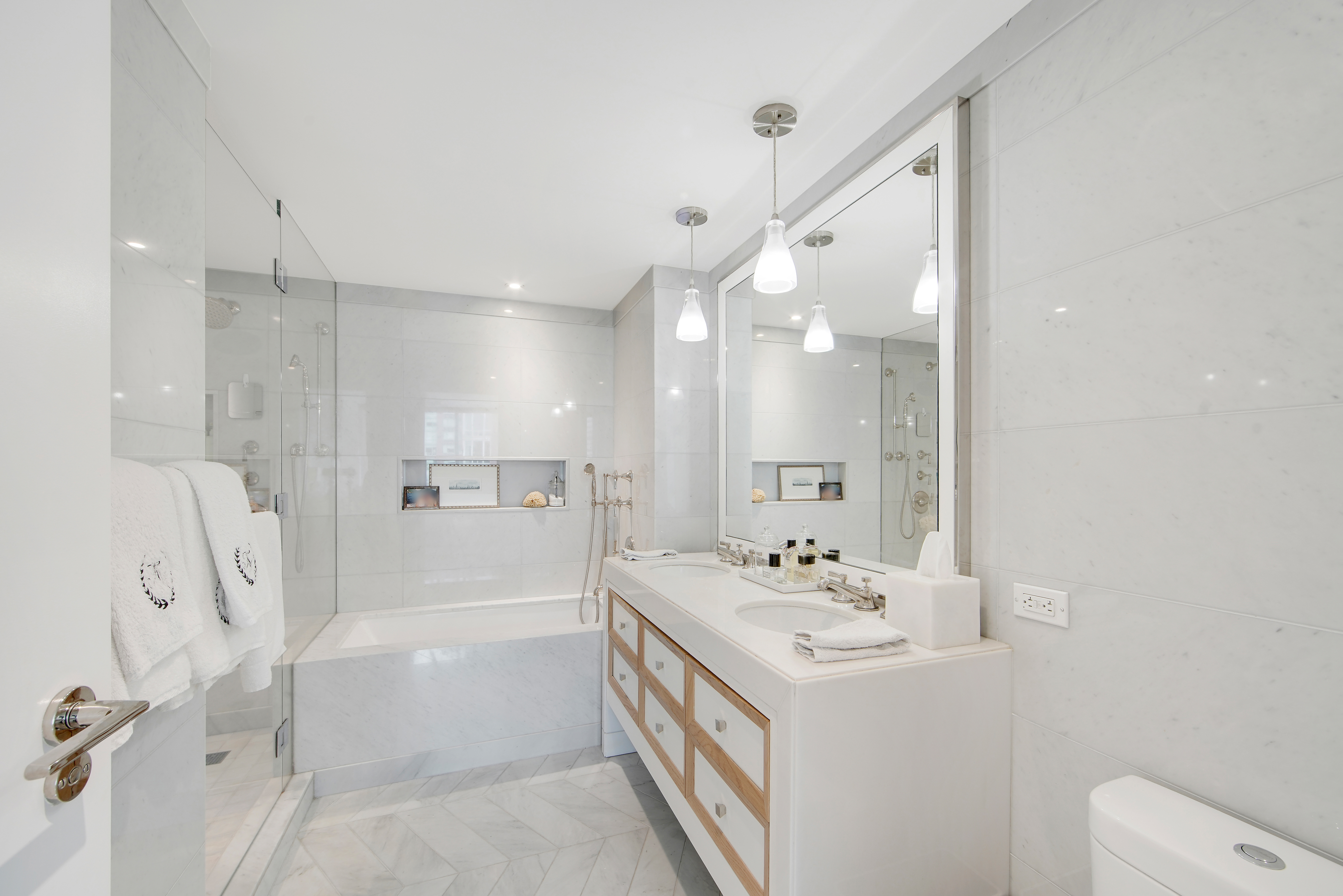 212 Warren Street, Unit 17S Manhattan, NY 10282 - Photo 8 of 15 a bathroom with a sink a toilet and shower