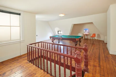 a bedroom with furniture and a window