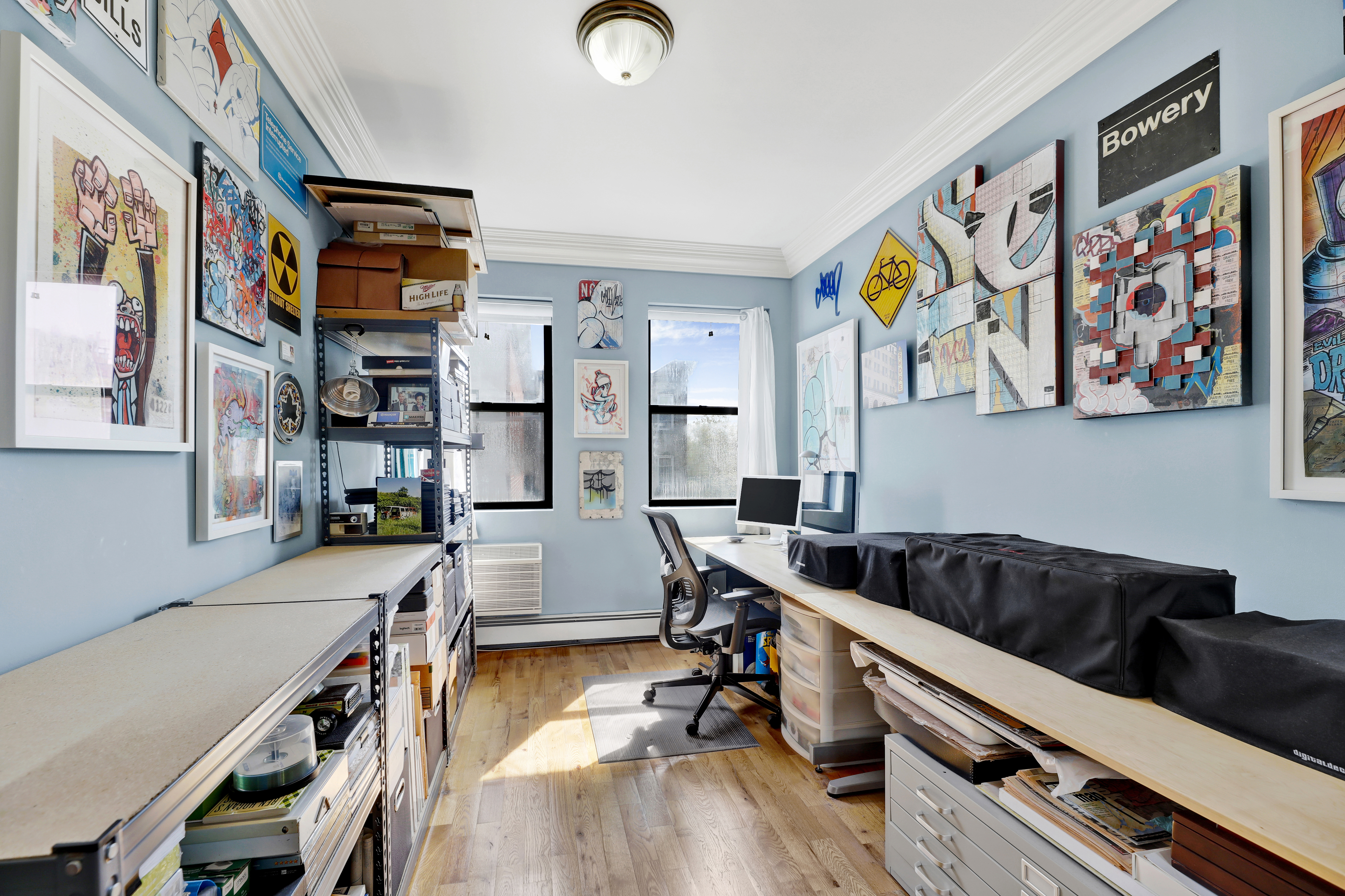 36 Russell Street, Unit 22 Brooklyn, NY 11222 - Photo 24 of 27 a room with furniture and paintings on the wall