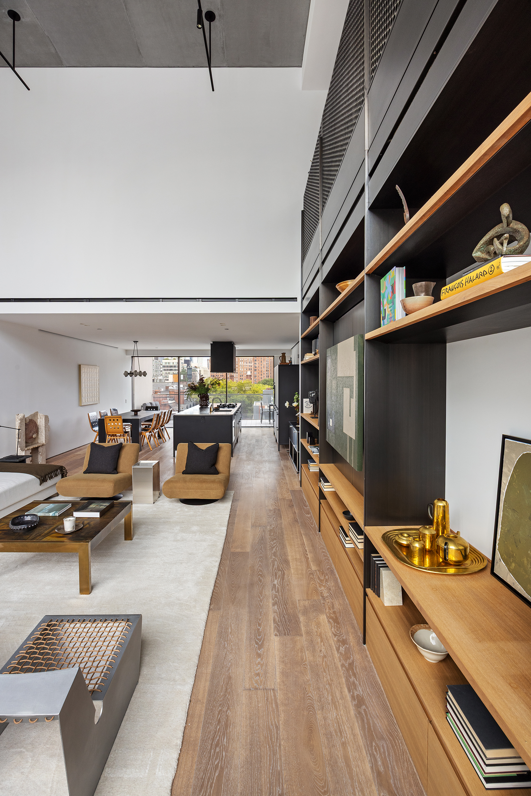 455 West 19th Street, Unit PH2 Manhattan, NY 10011 - Photo 6 of 26 a living room with furniture and a flat screen tv