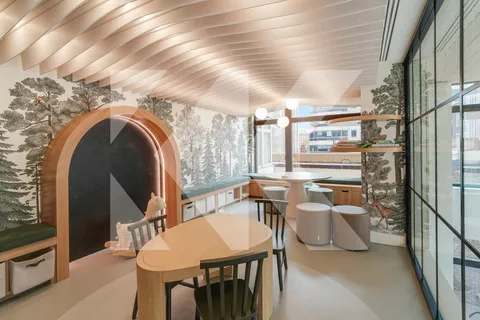 a dining room with furniture and a floor to ceiling window