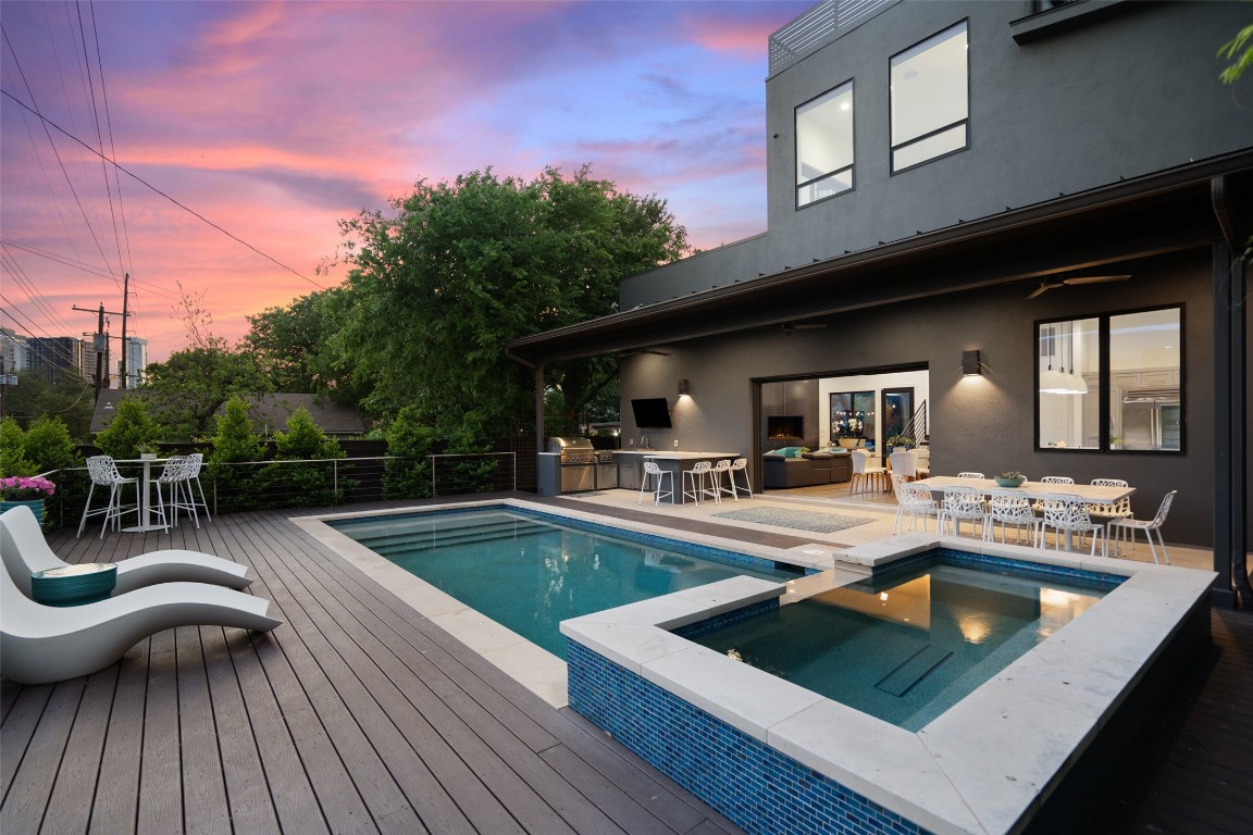 1207 East 13th Street Austin, TX 78702 - Photo 6 of 39 a view of a patio with dining table and chairs with wooden floor and fence
