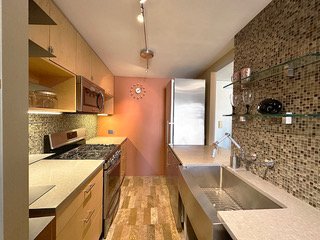 215 West 95th Street, Unit 11A Manhattan, NY 10025 - Photo 2 of 9 a kitchen that has a sink and a stove